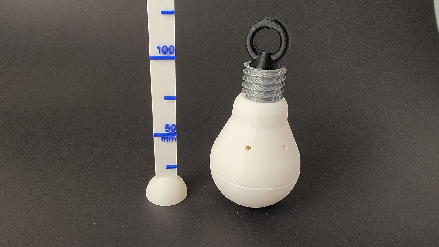 Light bulb scent hide size comparison, nose work training container