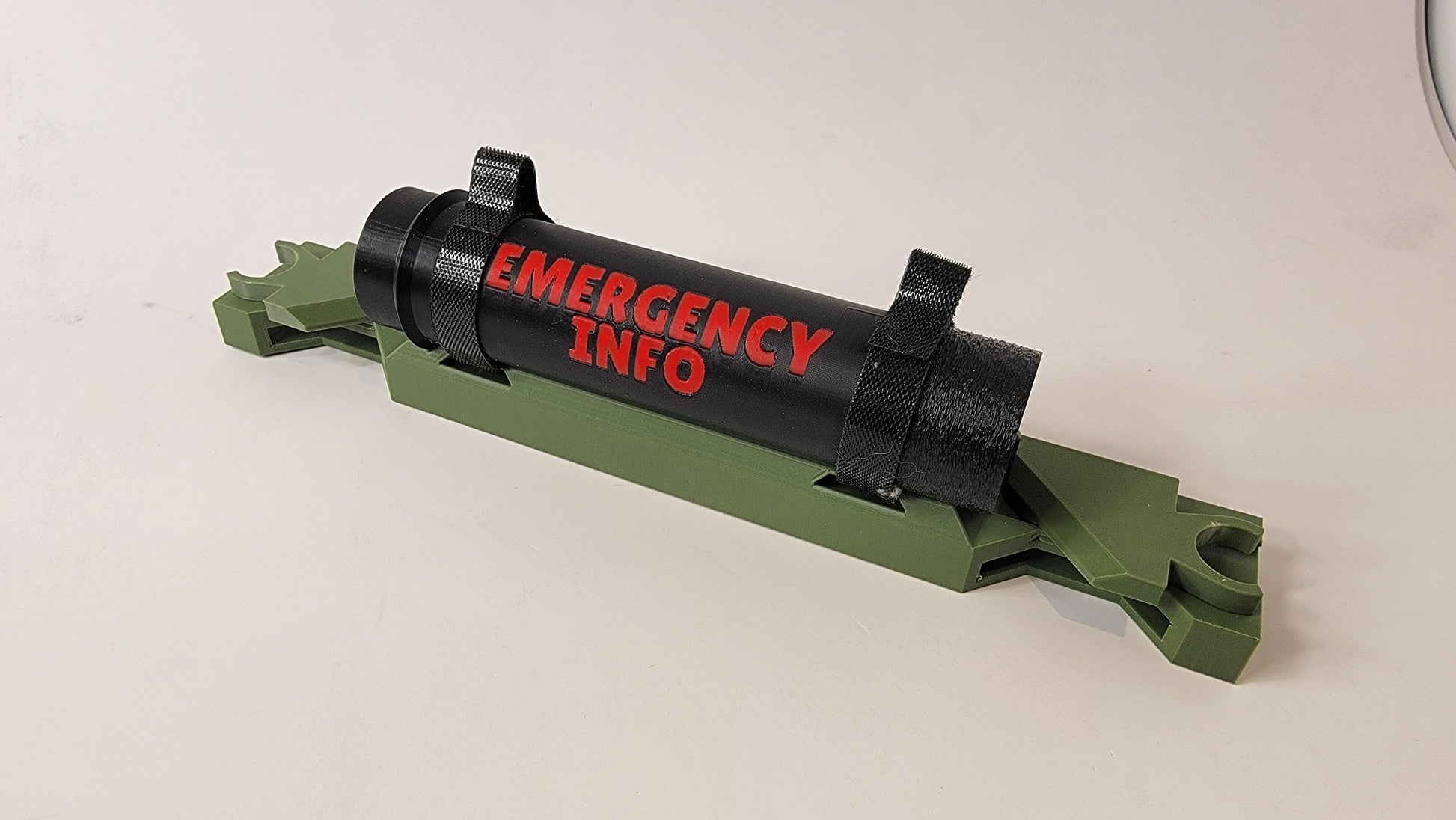 Close up of bracket and tube for Ruffland Kennel emergency contact