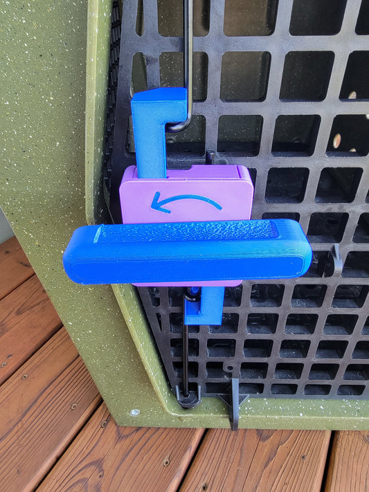 Blue and purple 3D-printed turn-to-open door lever installed on olive green Ruffland kennel, with custom arrow on box