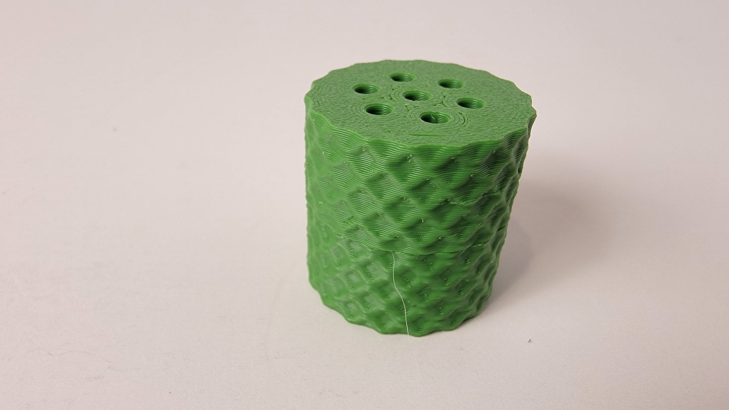 Close-up of mini scent hide vent opening, nose work training container detail